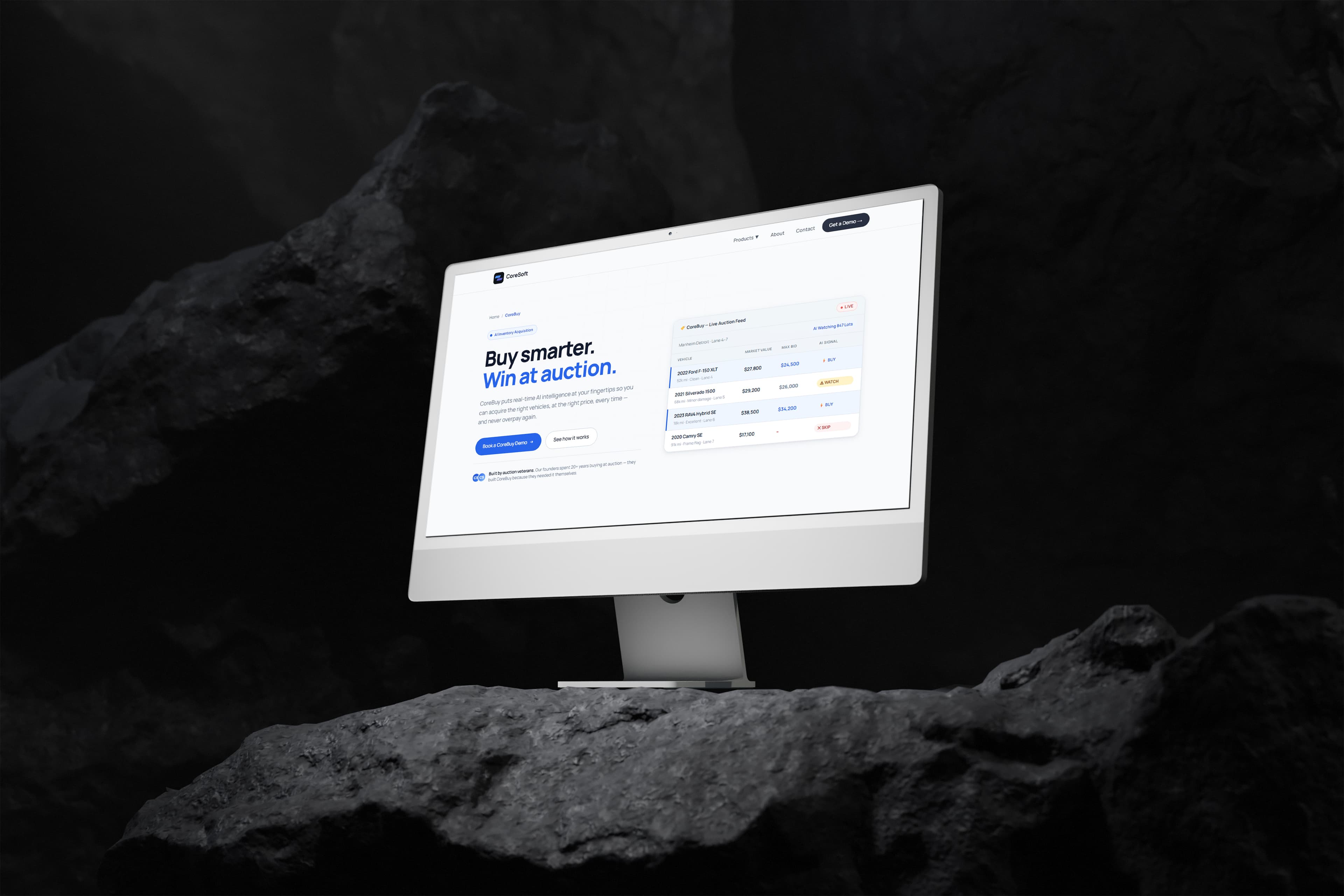 Coresoft CoreBuy landing page — “Buy smarter. Win at auction.” with a live auction feed