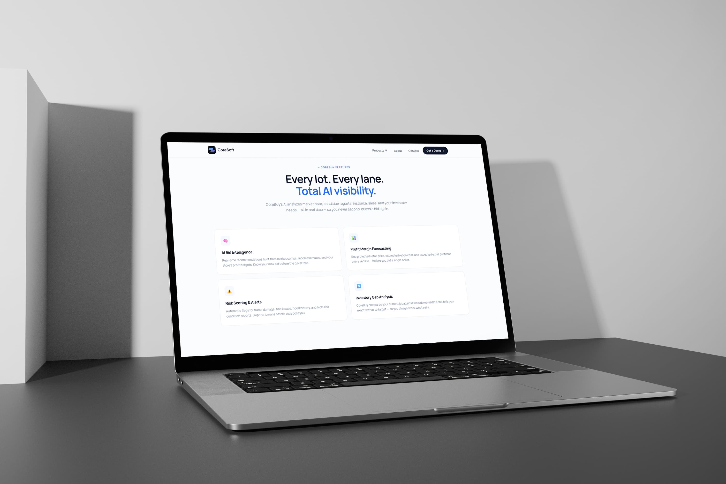 Coresoft CoreBuy features page — “Every lot. Every lane. Total AI visibility.” with AI bid intelligence, profit margin forecasting and risk scoring
